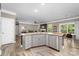 Open floor plan with modern kitchen featuring granite countertops, stainless appliances, and a dining area at 3615 Alamito Ln, Charlotte, NC 28214