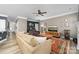 Comfortable living room featuring a cozy seating area, stylish decor, and wood laminate flooring at 3615 Alamito Ln, Charlotte, NC 28214