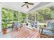 Cozy screened porch featuring a ceiling fan and comfortable seating for relaxing outdoors at 3615 Alamito Ln, Charlotte, NC 28214