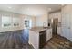 Bright kitchen featuring stainless steel appliances, granite countertops, and an open layout to the living area at 4217 Summit Woods Dr, Charlotte, NC 28216