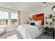 Bright bedroom with ample natural light, neutral walls and carpet, and orange headboard at 4229 Summit Woods Dr, Charlotte, NC 28216