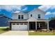 Charming two-story home with a brick and siding facade, a two-car garage, and a well-maintained front yard at 425 Bent Burr Crk, York, SC 29745