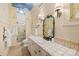Bright bathroom with unique painted ceiling, tiled shower, and custom vanity with decorative mirror at 4523 Fox Brook Ln, Charlotte, NC 28211