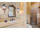 Updated bathroom features marble countertops, custom lighting, and a glass-enclosed shower at 4523 Fox Brook Ln, Charlotte, NC 28211