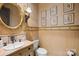 Charming half bathroom features a decorative mirror and custom vanity at 4523 Fox Brook Ln, Charlotte, NC 28211