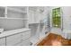 Spacious walk-in closet offers custom shelving and ample storage solutions at 4523 Fox Brook Ln, Charlotte, NC 28211