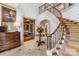 Open and airy foyer area featuring a staircase with iron railings at 4523 Fox Brook Ln, Charlotte, NC 28211
