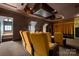 Beautiful home theater features plush seating, unique design and decor, and a large screen for an immersive viewing experience at 4523 Fox Brook Ln, Charlotte, NC 28211