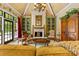 Comfortable living room showcases built-in cabinets, fireplace, and access to the outdoor pool at 4523 Fox Brook Ln, Charlotte, NC 28211