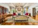 Formal living room with a fireplace, hardwood floors and elegant decor at 4523 Fox Brook Ln, Charlotte, NC 28211