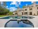 Back of home features a gorgeous pool and outdoor lounge area, perfect for relaxing and entertaining at 4523 Fox Brook Ln, Charlotte, NC 28211