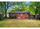 Charming brick home featuring a spacious backyard perfect for outdoor entertaining and activities at 4647 General Pershing Dr, Charlotte, NC 28209