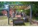 The backyard features an outdoor living space with seating, mature trees, and a firepit at 4647 General Pershing Dr, Charlotte, NC 28209