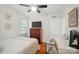 Cozy bedroom featuring hardwood floors, desk and chair at 4647 General Pershing Dr, Charlotte, NC 28209