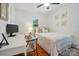 Well-lit bedroom with hardwood floors, desk and chair at 4647 General Pershing Dr, Charlotte, NC 28209