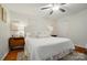 Comfortable bedroom with neutral tones, ceiling fan, and hardwood floors at 4647 General Pershing Dr, Charlotte, NC 28209