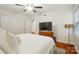 Relaxing bedroom with hardwood floors, ceiling fan, and natural light at 4647 General Pershing Dr, Charlotte, NC 28209