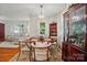 Elegant dining room with a round table, upholstered chairs, and a stylish chandelier at 4647 General Pershing Dr, Charlotte, NC 28209