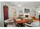 Open dining room with a large table, adjacent to the living space with hardwood floors at 4647 General Pershing Dr, Charlotte, NC 28209