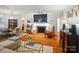 Open living space featuring a fireplace, hardwood floors, and stylish furnishings at 4647 General Pershing Dr, Charlotte, NC 28209