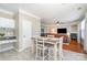 Eat-in kitchen/dining area with hardwood floors and seating for four, filled with natural light at 4711 Sunburst Ln, Charlotte, NC 28213