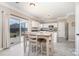 Eat-in kitchen/dining area with hardwood floors and seating for four and backyard access at 4711 Sunburst Ln, Charlotte, NC 28213