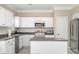 Bright kitchen with stainless steel appliances, granite countertops, and white cabinetry at 4711 Sunburst Ln, Charlotte, NC 28213