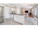 Bright kitchen with stainless steel appliances and island adjacent to open-concept dining area at 4711 Sunburst Ln, Charlotte, NC 28213