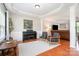 Elegant living room with coffered ceiling, piano, comfortable seating, and hardwood floors at 4711 Sunburst Ln, Charlotte, NC 28213
