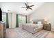Spacious main bedroom with vaulted ceiling, large bed, and ensuite bath at 4711 Sunburst Ln, Charlotte, NC 28213
