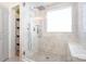 Modern shower with built-in bench, rain shower head, and decorative shelving at 4711 Sunburst Ln, Charlotte, NC 28213