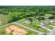 Aerial view showcasing the house, its large backyard, and the surrounding green, wooded landscape in a rural setting at 5052 Swinging Bridge Rd, Conover, NC 28613