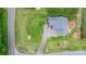 Aerial view showcases the property's layout, including a well-maintained lawn, garden, and driveway at 5052 Swinging Bridge Rd, Conover, NC 28613