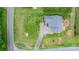 Aerial view showcases the property's layout, including a well-maintained lawn, garden, and driveway at 5052 Swinging Bridge Rd, Conover, NC 28613