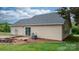 Home exterior featuring a wooden deck, sliding glass doors, and a cozy fire pit area at 5052 Swinging Bridge Rd, Conover, NC 28613