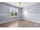 This bedroom features hardwood floors, crown molding, and a sunny window at 5052 Swinging Bridge Rd, Conover, NC 28613