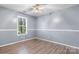 This bedroom features hardwood floors, crown molding, and a sunny window at 5052 Swinging Bridge Rd, Conover, NC 28613