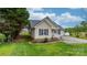 A charming home with manicured landscaping and flowering plants adding to its curb appeal at 5052 Swinging Bridge Rd, Conover, NC 28613