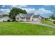 Charming single-Gathering home featuring a well-manicured lawn and inviting curb appeal at 5052 Swinging Bridge Rd, Conover, NC 28613