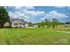 Single-story home featuring well-maintained landscaping and a sprawling green lawn in a tranquil setting at 5052 Swinging Bridge Rd, Conover, NC 28613