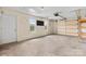 Spacious garage with concrete flooring, bright windows, and an automatic garage door at 5052 Swinging Bridge Rd, Conover, NC 28613