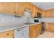 Well-lit kitchen featuring natural wood cabinets, stainless steel appliances, and modern fixtures at 5052 Swinging Bridge Rd, Conover, NC 28613