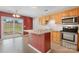Open kitchen layout with island, stainless steel appliances, and access to backyard at 5052 Swinging Bridge Rd, Conover, NC 28613