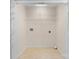 Convenient laundry room with tile flooring, hook ups, and shelving for storage at 5052 Swinging Bridge Rd, Conover, NC 28613