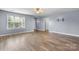 Bright and spacious living room with hardwood floors, large windows and neutral paint at 5052 Swinging Bridge Rd, Conover, NC 28613
