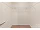 This walk-in closet offers ample storage with shelving and a carpeted floor at 5052 Swinging Bridge Rd, Conover, NC 28613