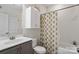 Clean bathroom features a shower-tub combo, a white toilet and vanity with storage at 5663 Morris Hunt Dr, Fort Mill, SC 29708