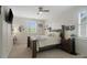 Comfortable bedroom with neutral tones, a wood bed frame, and natural light from the window at 5663 Morris Hunt Dr, Fort Mill, SC 29708