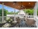 Spacious covered patio is great for entertaining, features comfortable seating and ceiling fans at 5663 Morris Hunt Dr, Fort Mill, SC 29708