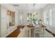 Bright dining room with ample natural light, featuring a stylish dining set and custom built-ins at 5663 Morris Hunt Dr, Fort Mill, SC 29708